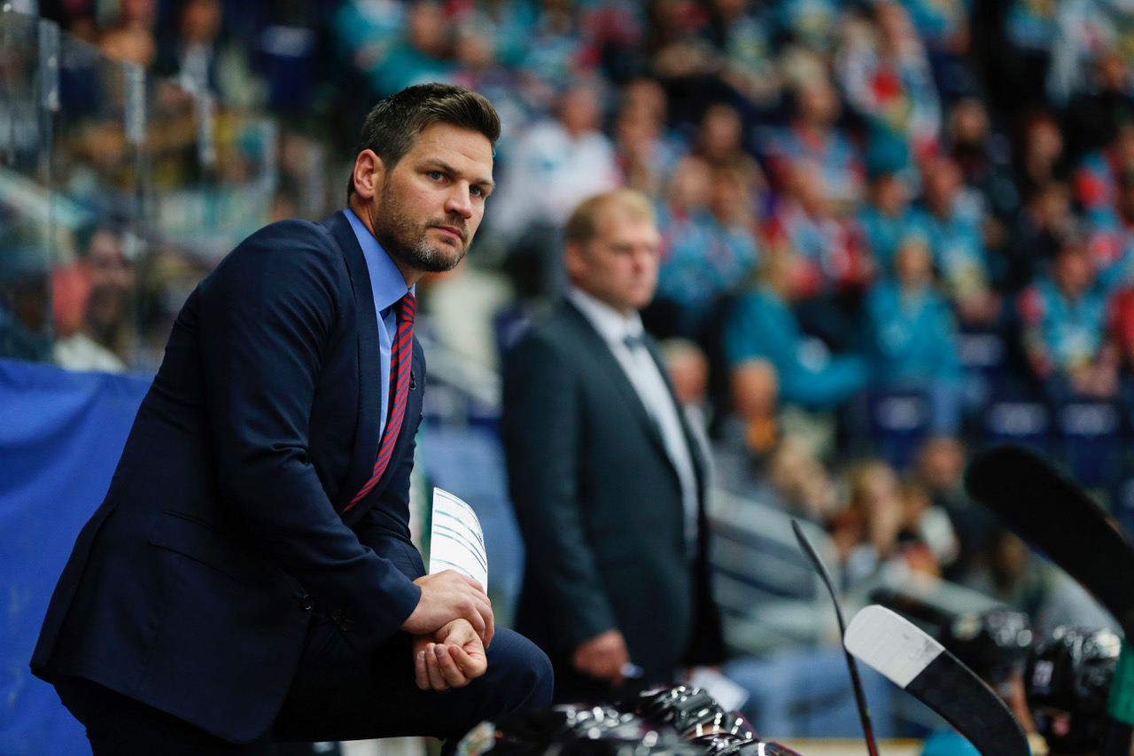 Adam Keefe of Giants watch his team.